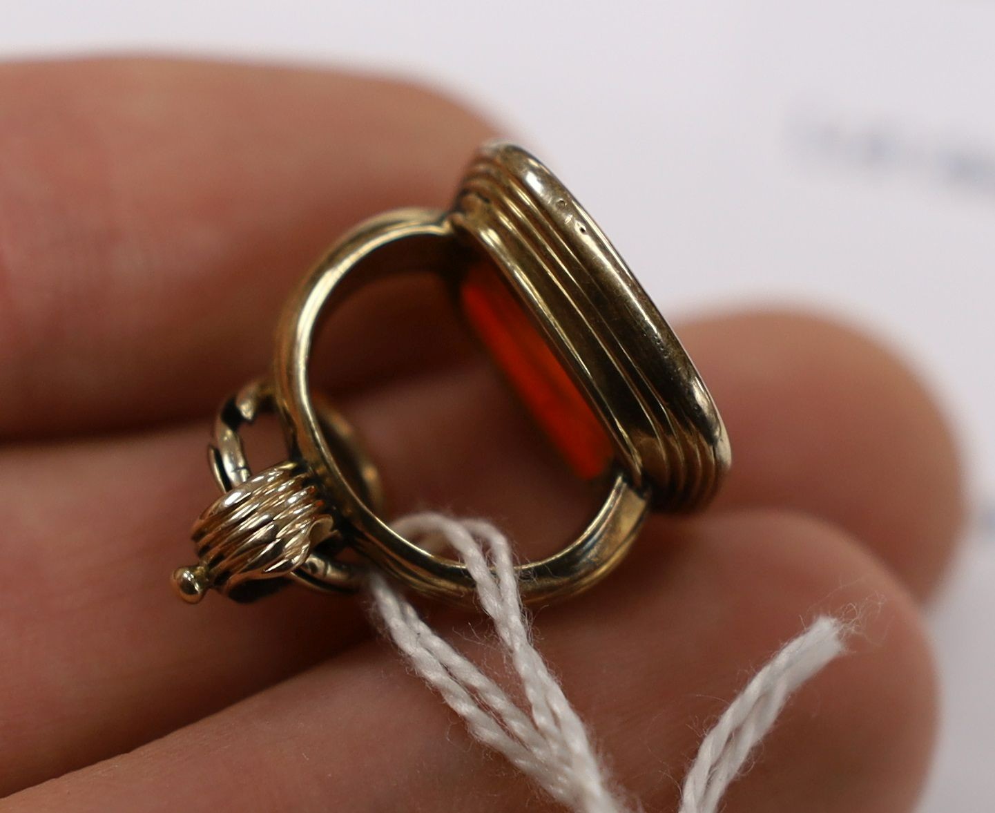 A Victorian yellow metal overlaid seal and and intaglio carnelian set seal, 21mm and a yellow metal and agate set brooch.
